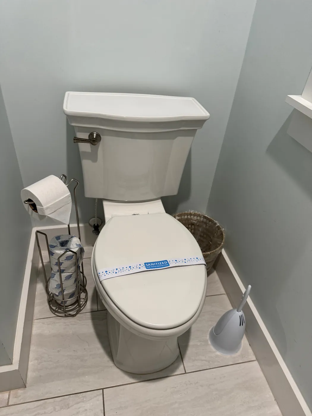 Sanitized seal placed on a toilet after a rental property cleaning
