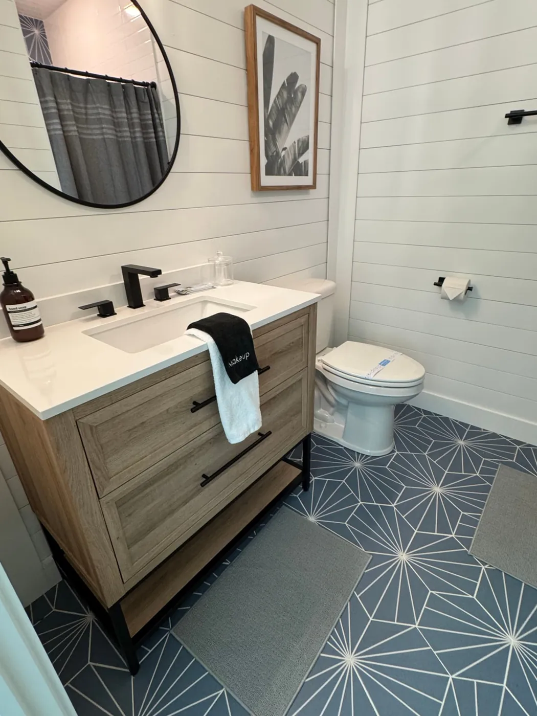 Bathroom vanity with fresh folded towels after a rental turnover