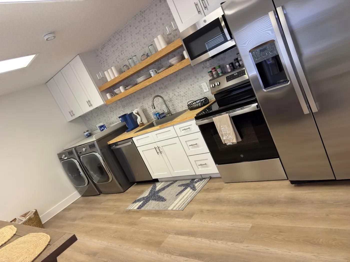 Rental kitchen and laundry area cleaned and organized