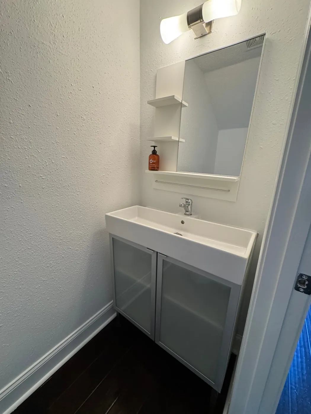Modern bathroom vanity cleaned and staged for a rental guest