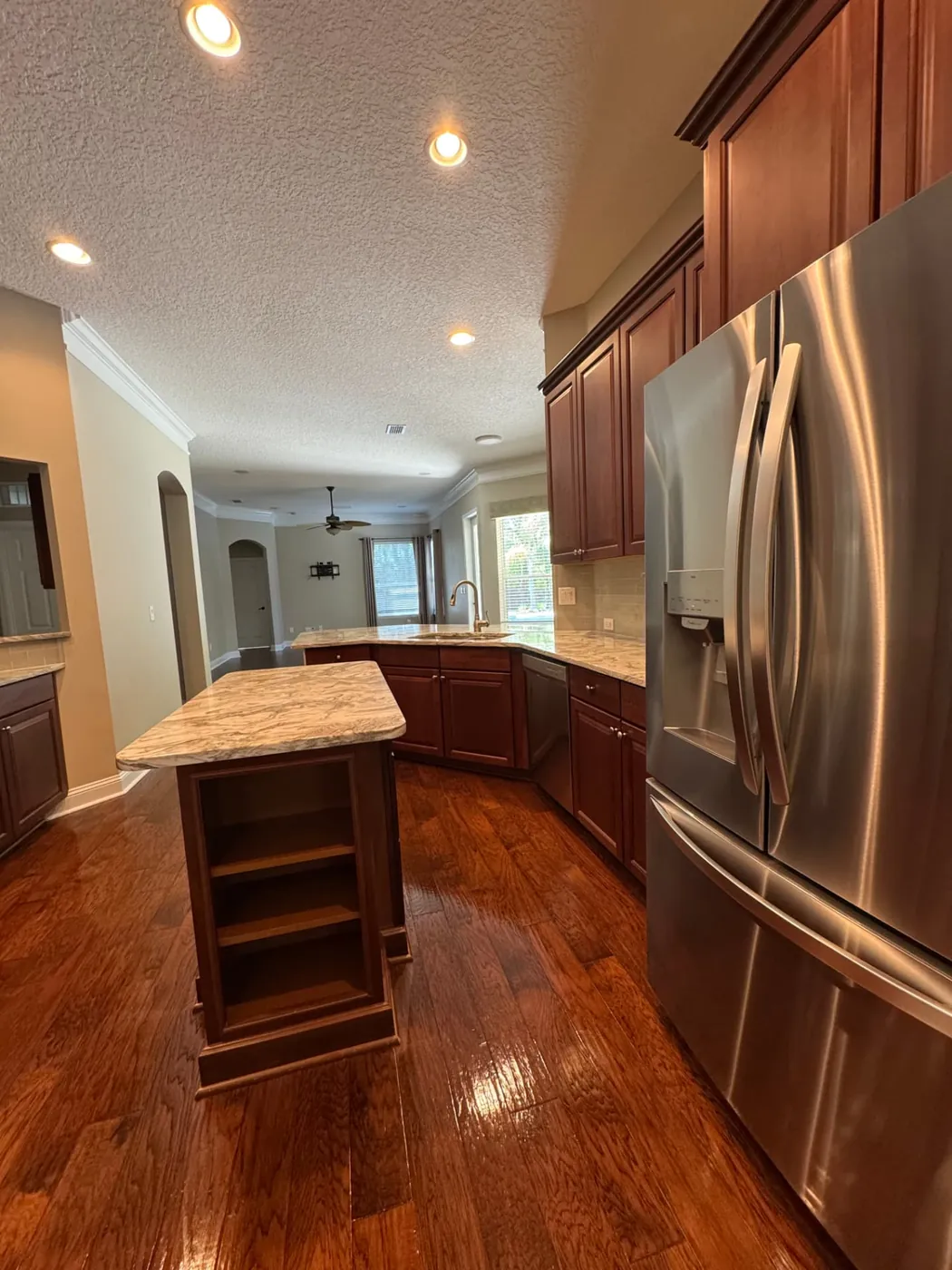 Kitchen with gleaming hardwood floors after a deep cleaning