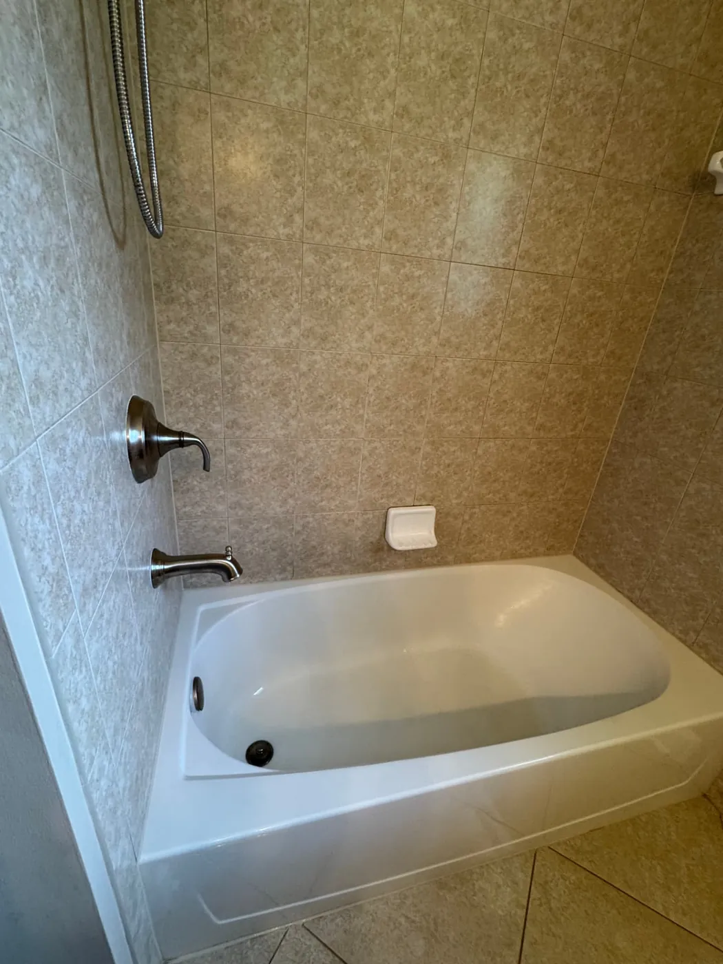 Bathtub and tiled shower deep cleaned and sanitized